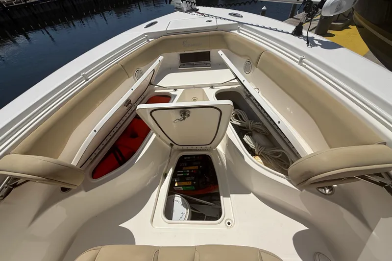 Slide: The Image of 2019 Key West Billistic 281 Center Console boat interior with storage compartments open. - 94