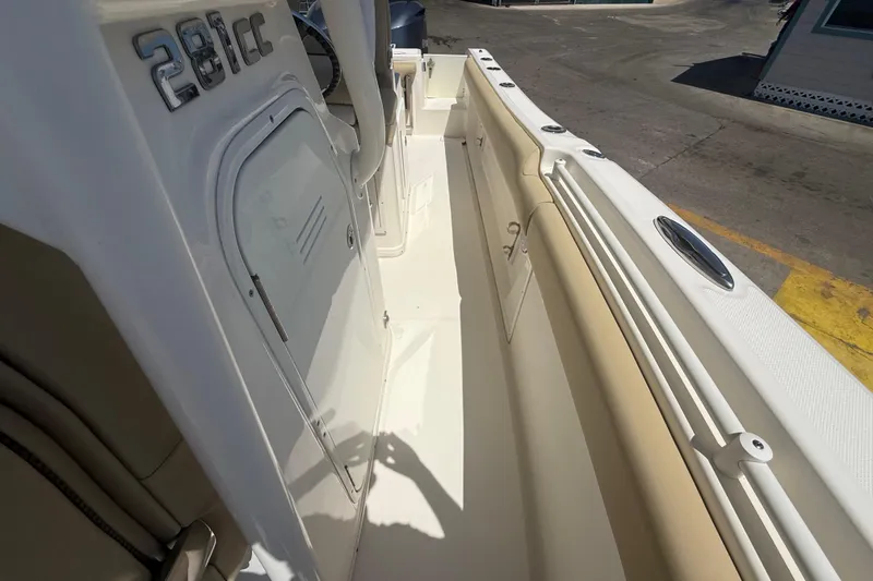 Slide: The Image of 2019 Key West Billistic 281 Center Console boat interior, featuring sleek design and storage compartments. - 98