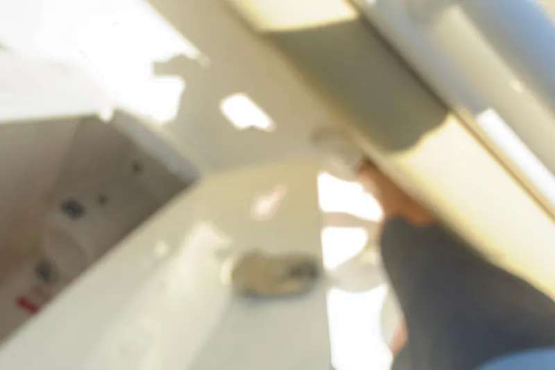 Slide: The Image of Blurry interior view of a 2019 Key West Billistic 281 Center Console boat. - 99