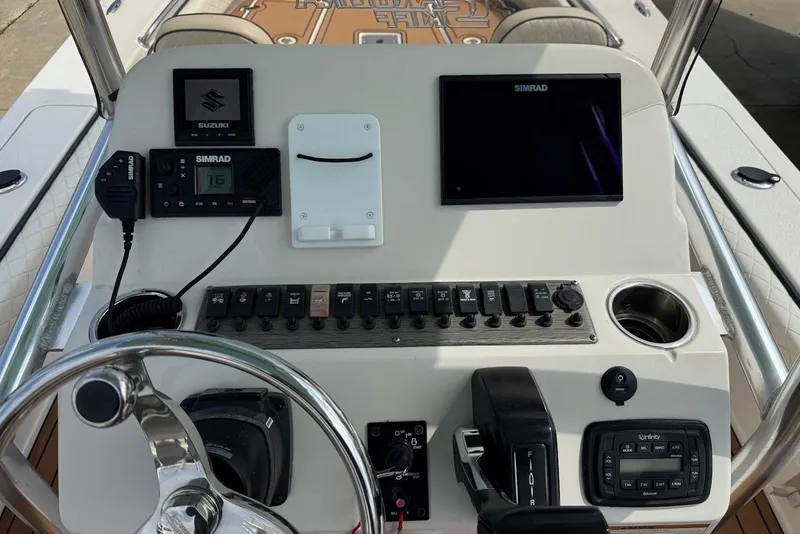 Slide: The Image of Control panel of a 2020 Carolina Skiff 26 Ultra Elite boat with Simrad electronics. - 20