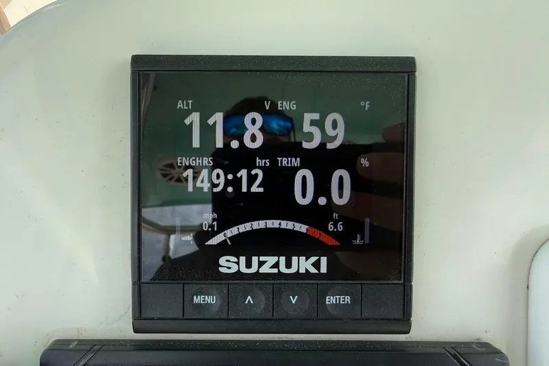Slide: The Image of Suzuki engine display on 2020 Carolina Skiff 26 Ultra Elite, showing altitude and engine hours. - 21