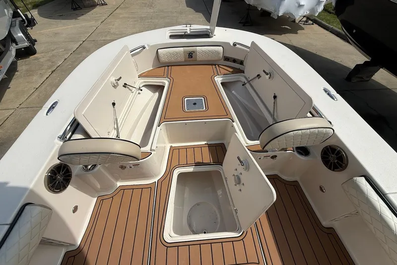 Slide: The Image of 2020 Carolina Skiff 26 Ultra Elite boat interior with open storage compartments. - 28