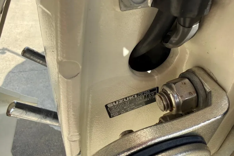 Slide: The Image of Close-up of a Suzuki outboard motor on a 2020 Carolina Skiff 26 Ultra Elite. - 30