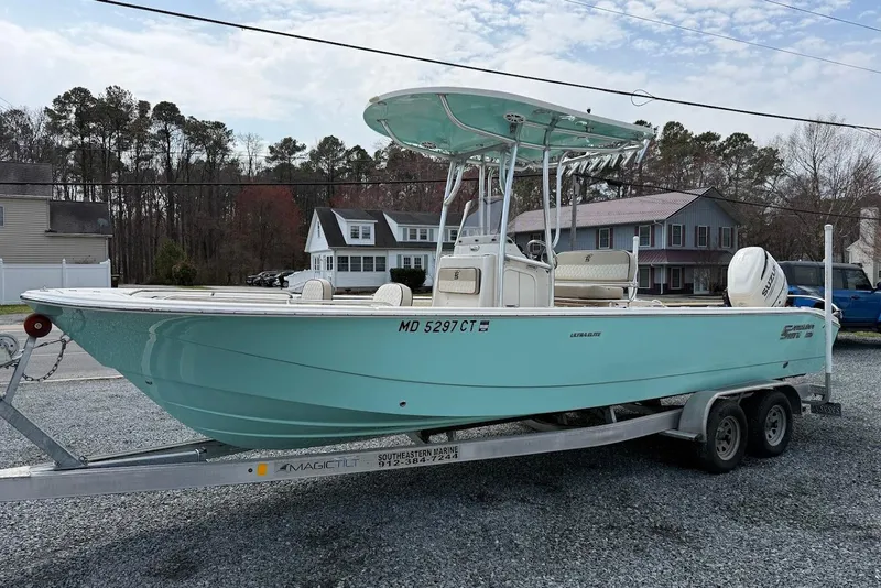 Slide: The Image of 2020 Carolina Skiff 26 Ultra Elite boat on trailer, parked outdoors. - 8