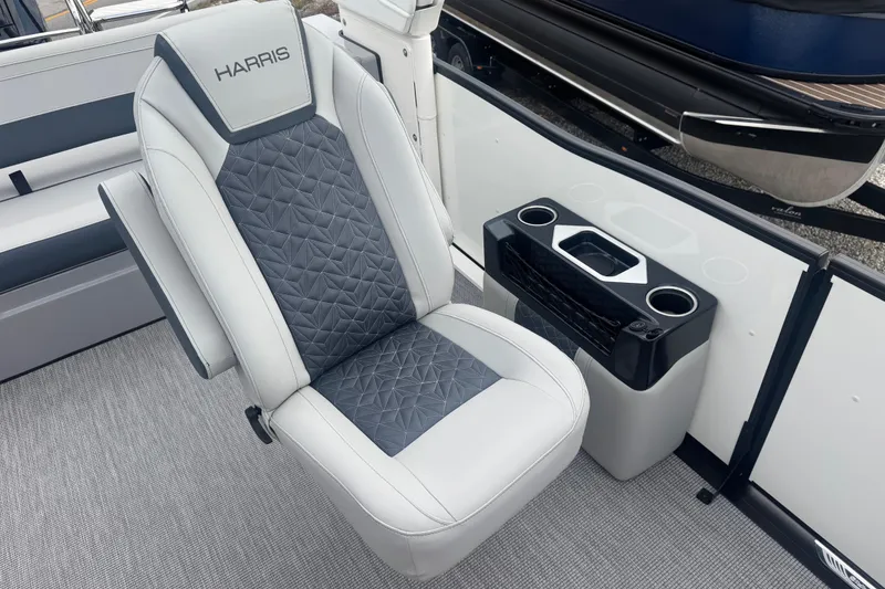 Slide: The Image of 2026 Harris Grand Mariner 250 SLDH boat seat with cup holders and modern design. - 10