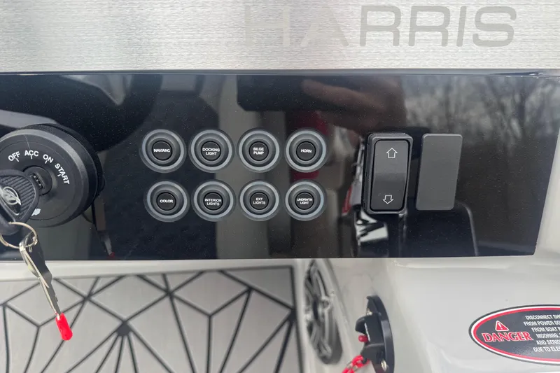 Slide: The Image of Control panel of 2026 Harris Grand Mariner 250 SLDH with ignition and various switches. - 11