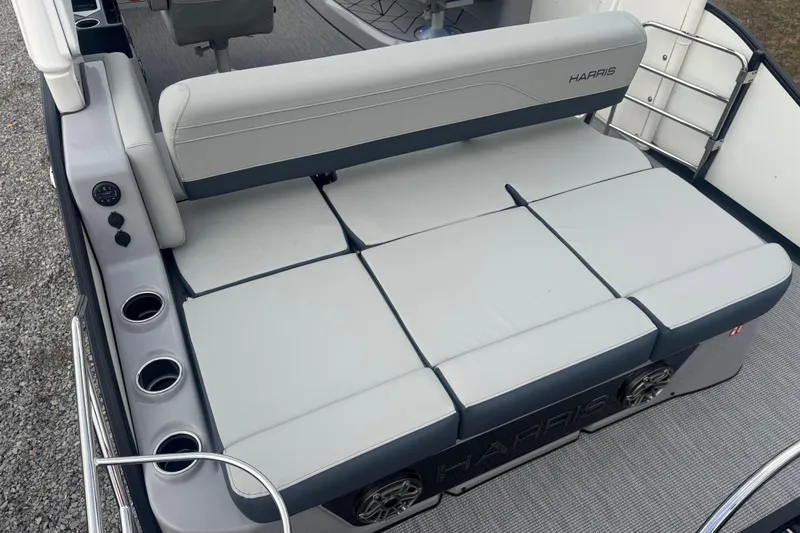 Slide: The Image of 2026 Harris Grand Mariner 250 SLDH boat interior with cushioned seating and cup holders. - 5