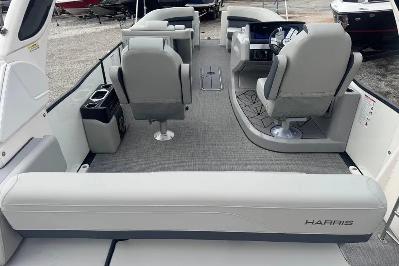 Slide: The Image of 2026 Harris Grand Mariner 250 SLDH pontoon boat interior with modern seating and helm. - 6