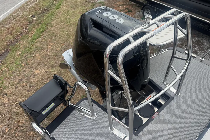 Slide: The Image of 2026 Harris Grand Mariner 250 SLDH boat with Mercury 400 engine and stainless steel railing. - 7