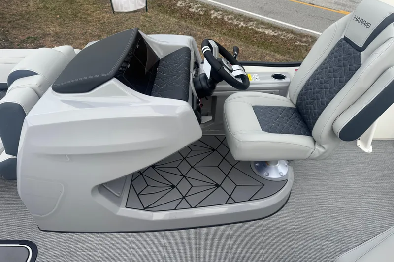 Slide: The Image of Captain's seat and helm of 2026 Harris Grand Mariner 250 SLDH boat, featuring modern design. - 9