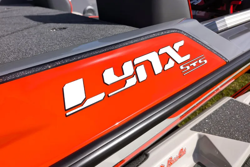 Slide: The Image of 2026 Bass Cat Lynx STS boat with bold red and white branding. - 17