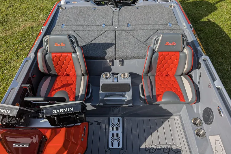Slide: The Image of 2026 Bass Cat Lynx STS boat interior with red and gray seats, Garmin electronics. - 20