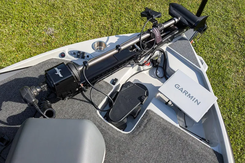 Slide: The Image of 2026 Bass Cat Lynx STS boat deck with Garmin electronics and trolling motor. - 23