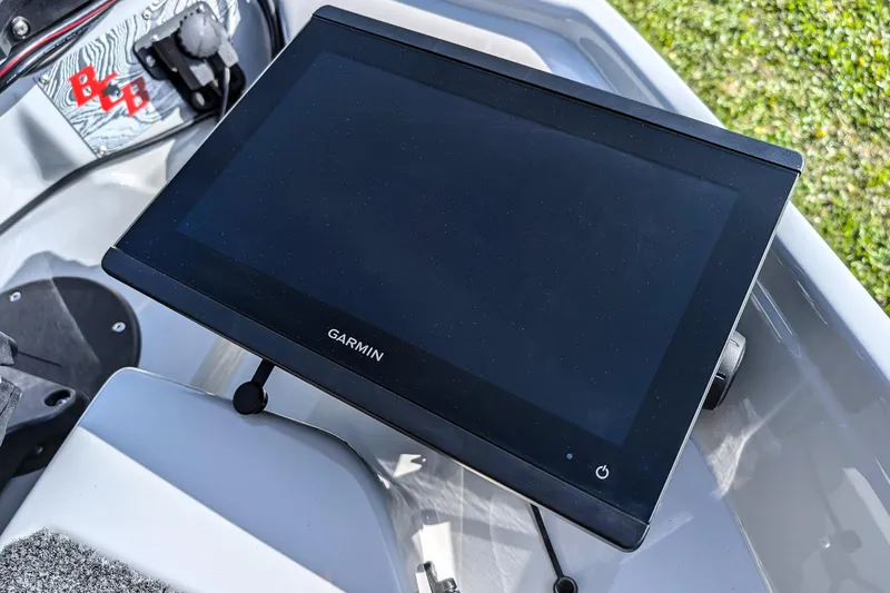 Slide: The Image of Garmin display on 2026 Bass Cat Lynx STS boat dashboard, close-up view. - 26