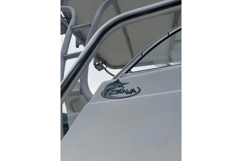 Slide: The Image of 2007 Sea Fox 236 Walk Around boat, close-up of logo and railing. - 4