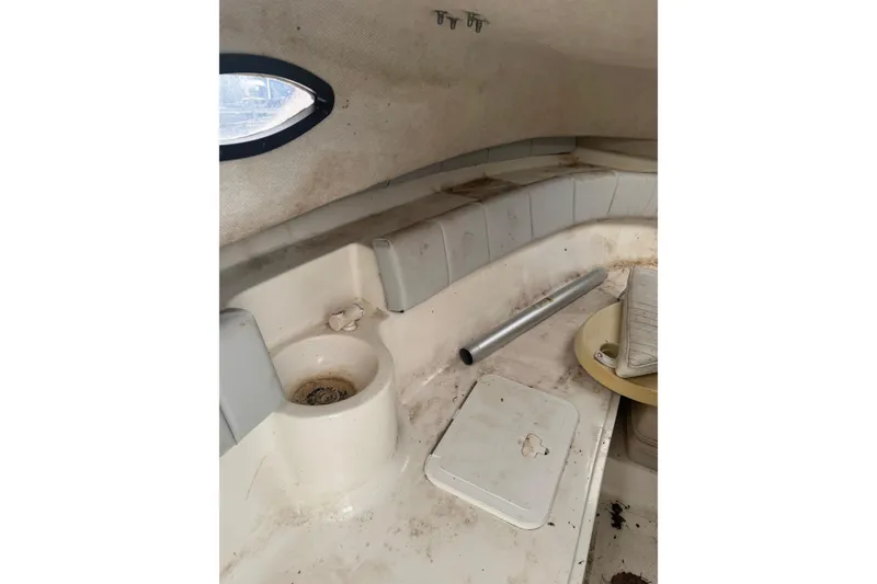 Slide: The Image of 2007 Sea Fox 236 Walk Around cabin interior with seating and storage compartments. - 8