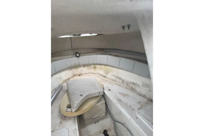 Slide: The Image of 2007 Sea Fox 236 Walk Around cabin interior with seating and storage compartments. - 9