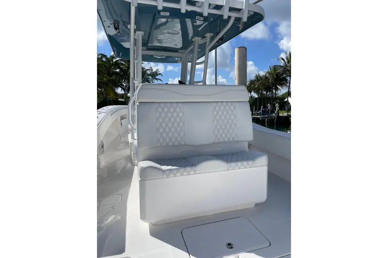 Slide: The Image of 2024 Invincible 36 Open Fisherman boat with white seating and blue canopy. - 10