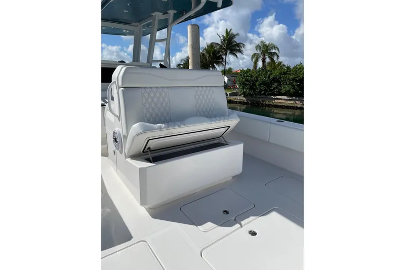 Slide: The Image of 2024 Invincible 36 Open Fisherman boat interior with cushioned seating and storage. - 14