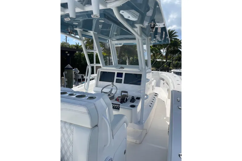 Slide: The Image of 2024 Invincible 36 Open Fisherman boat interior with modern helm and seating. - 16