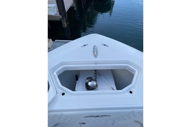 Slide: The Image of 2024 Invincible 36 Open Fisherman boat anchor compartment at dockside. - 22
