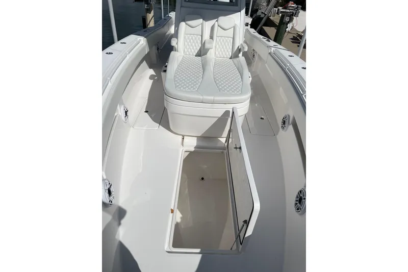 Slide: The Image of 2024 Invincible 36 Open Fisherman boat interior with open storage compartment. - 24