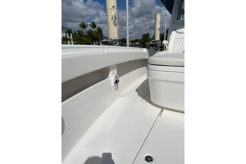 Slide: The Image of 2024 Invincible 36 Open Fisherman boat interior with seating and speaker detail. - 25