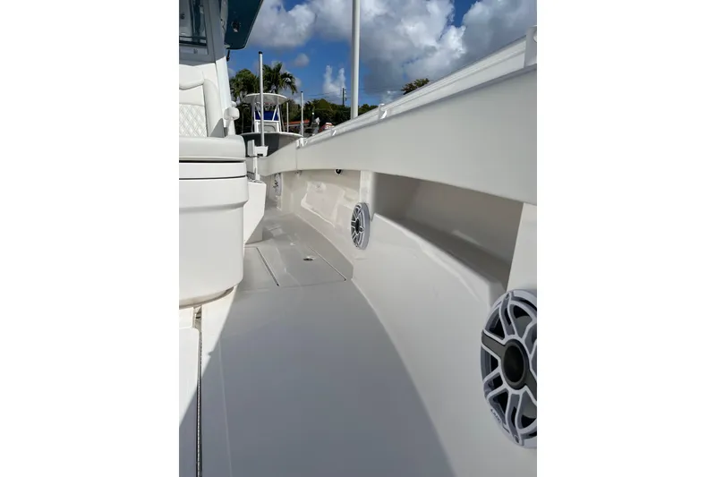 Slide: The Image of 2024 Invincible 36 Open Fisherman boat deck with speakers and seating. - 26