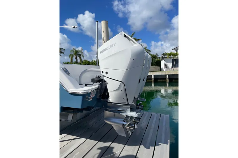 Slide: The Image of 2024 Invincible 36 Open Fisherman with Mercury outboard engine docked by water. - 3