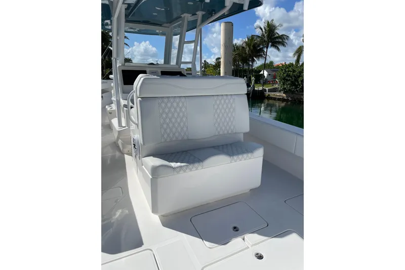 Slide: The Image of 2024 Invincible 36 Open Fisherman boat interior with white seating and sleek design. - 9