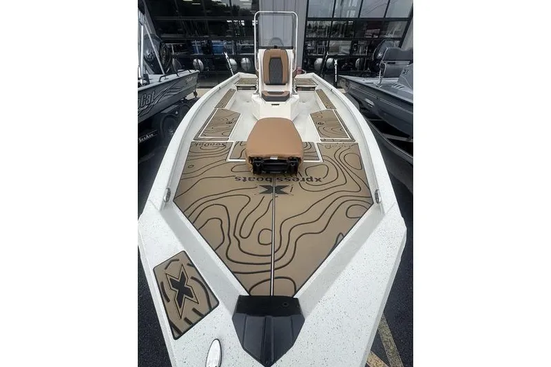 Slide: The Image of 2026 Xpress H22 boat with custom deck design and seating. - 12