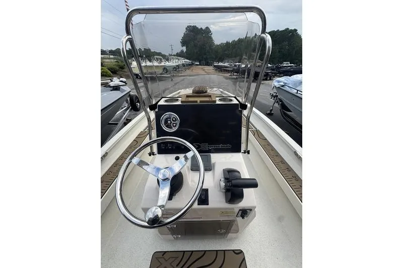 Slide: The Image of 2026 Xpress H22 boat dashboard with steering wheel and controls. - 19