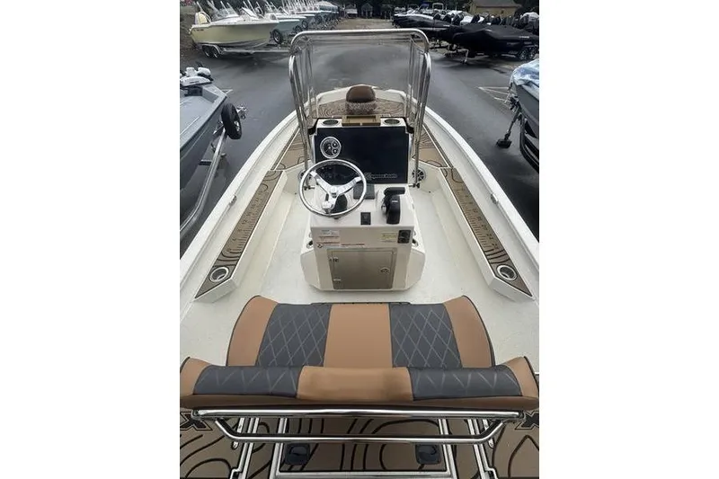 Slide: The Image of 2026 Xpress H22 boat interior with steering console and seating. - 20
