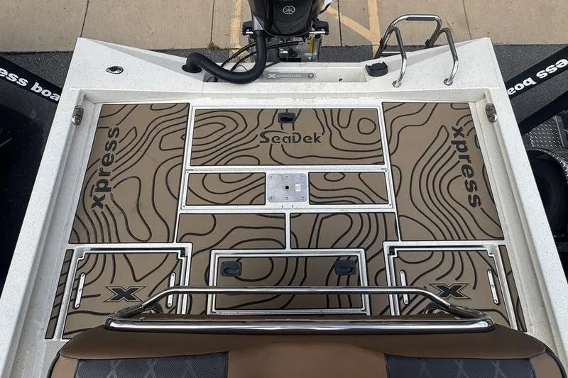 Slide: The Image of 2026 Xpress H22 boat deck with SeaDek flooring, featuring contour design and storage compartments. - 21