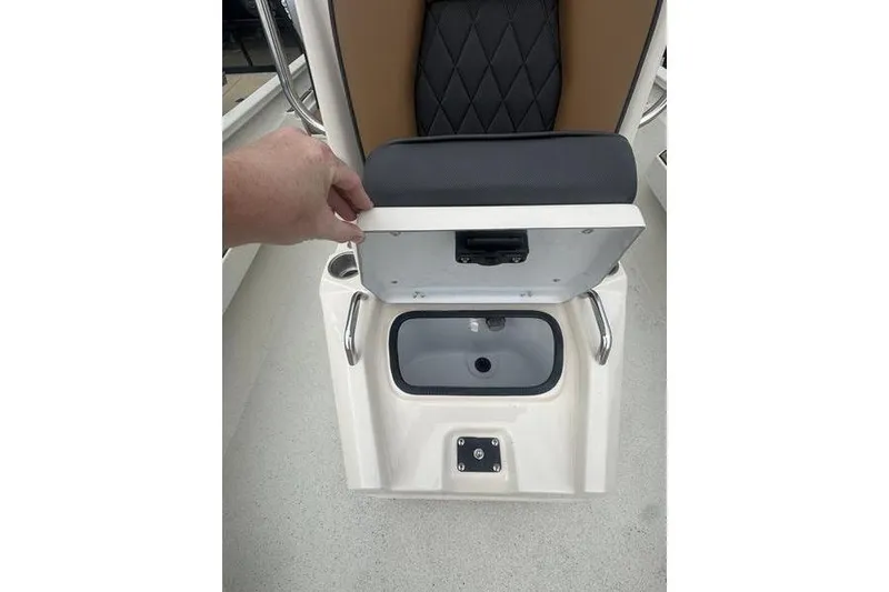 Slide: The Image of 2026 Xpress H22 boat seat with storage compartment open, showcasing interior design. - 24