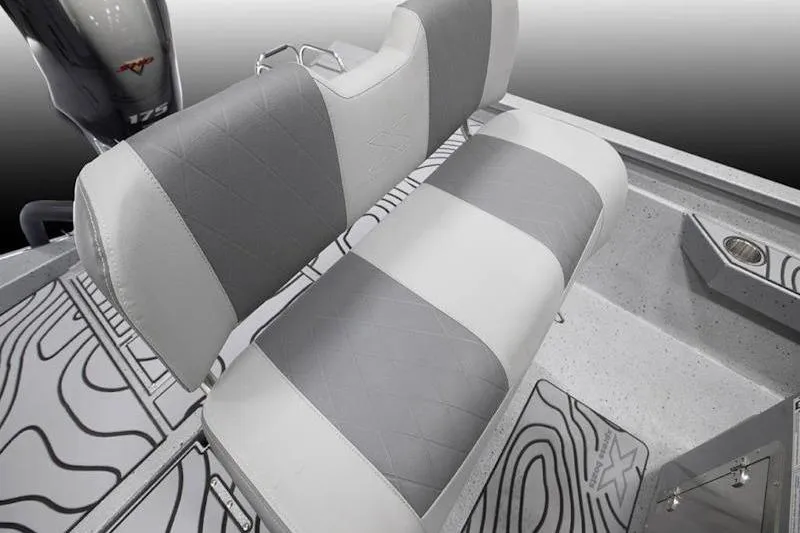 Slide: The Image of 2026 Xpress H22 boat interior with gray and white seating and patterned flooring. - 25