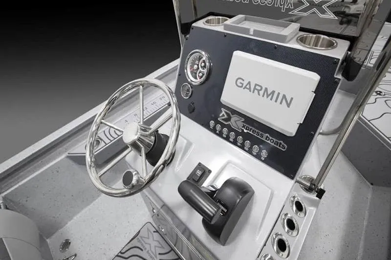 Slide: The Image of 2026 Xpress H22 boat console with Garmin navigation system and steering wheel. - 29