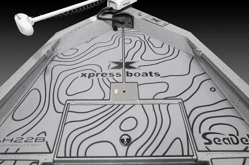 Slide: The Image of 2026 Xpress H22 boat deck with SeaDek, featuring contour design and branding. - 32
