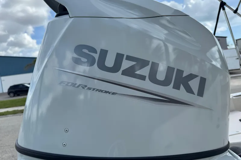 Slide: The Image of Suzuki four-stroke engine on a 2022 Carolina Skiff 19 LS boat. - 10