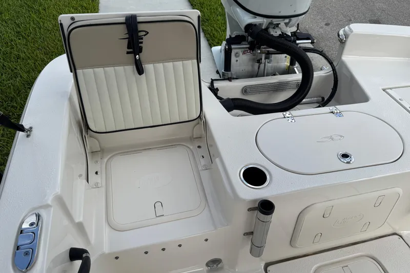 Slide: The Image of 2022 Carolina Skiff 19 LS boat interior with seating and storage compartments. - 25