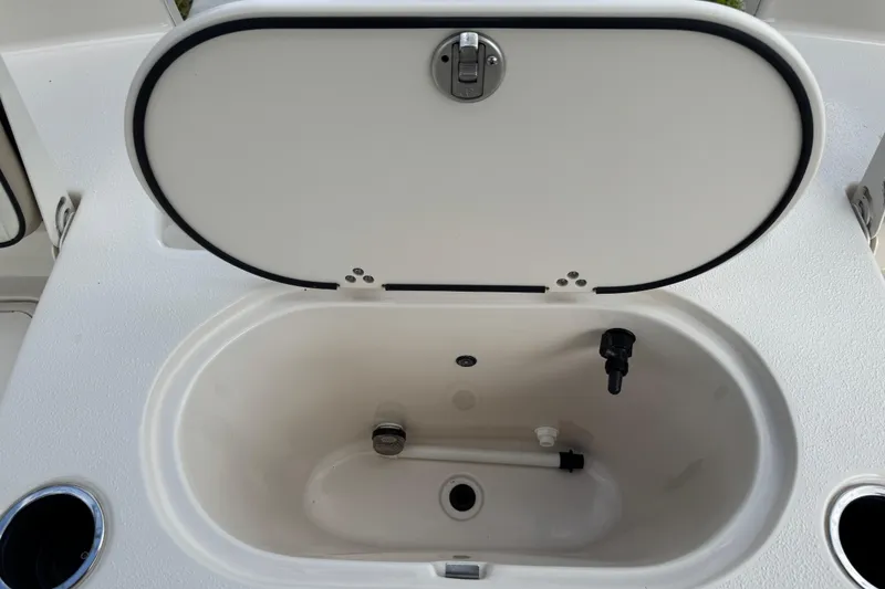 Slide: The Image of Open storage compartment on 2022 Carolina Skiff 19 LS boat deck. - 31