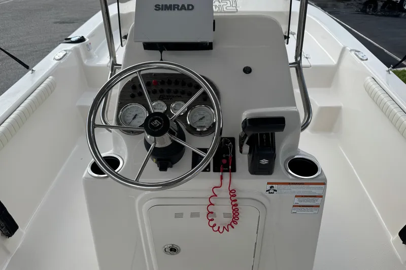 Slide: The Image of 2022 Carolina Skiff 19 LS boat console with steering wheel and controls. - 41