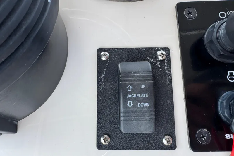Slide: The Image of Control panel of a 2022 Carolina Skiff 19 LS with jackplate switch. - 43