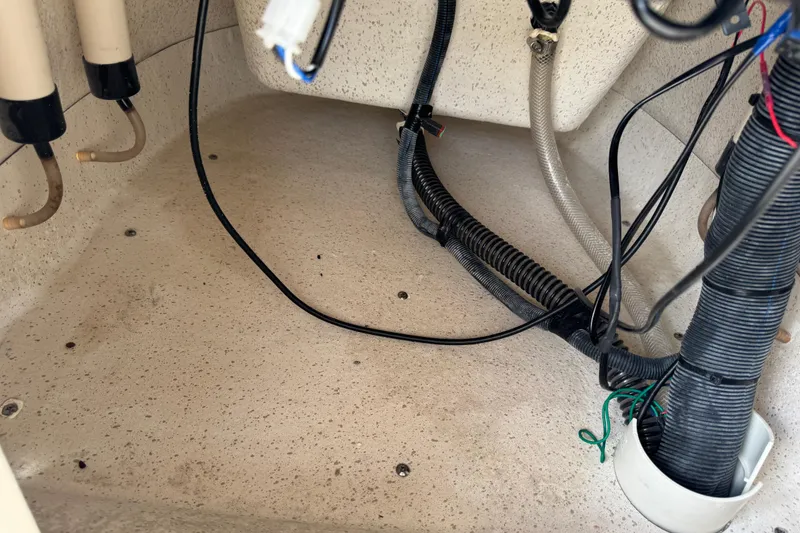 Slide: The Image of Interior wiring and tubing of a 2022 Carolina Skiff 19 LS boat. - 44