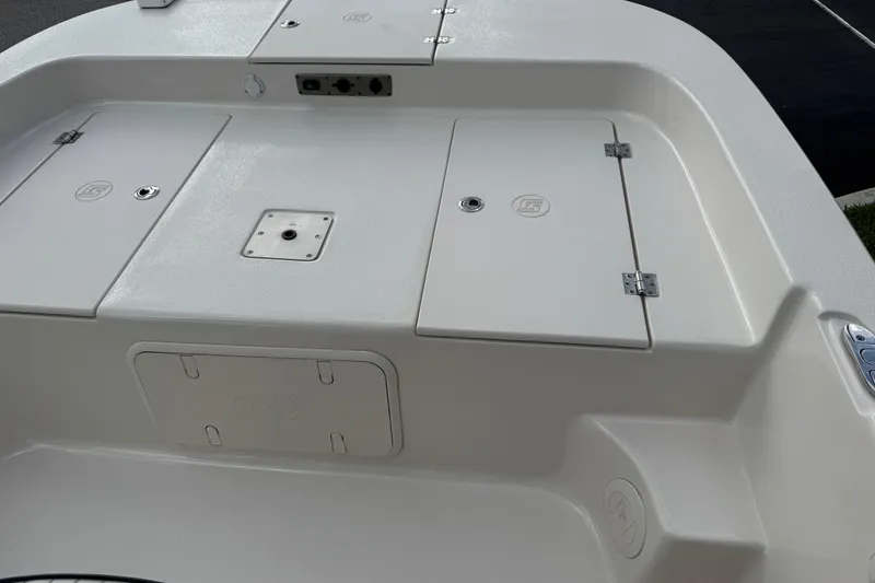 Slide: The Image of 2022 Carolina Skiff 19 LS boat deck with storage compartments and mounting point. - 47
