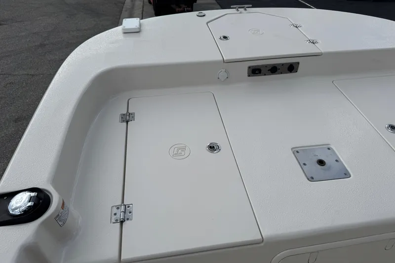 Slide: The Image of 2022 Carolina Skiff 19 LS boat deck with storage compartments and fittings. - 48
