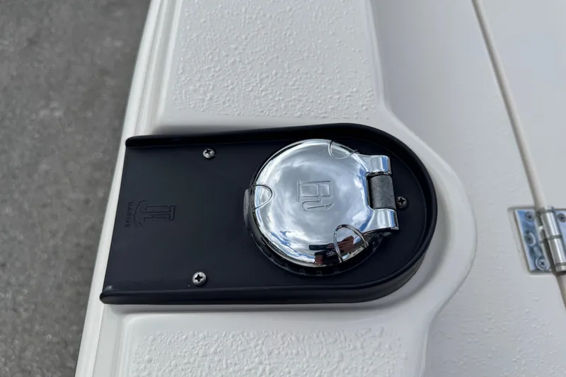 Slide: The Image of Chrome fuel cap on 2022 Carolina Skiff 19 LS boat deck. - 49