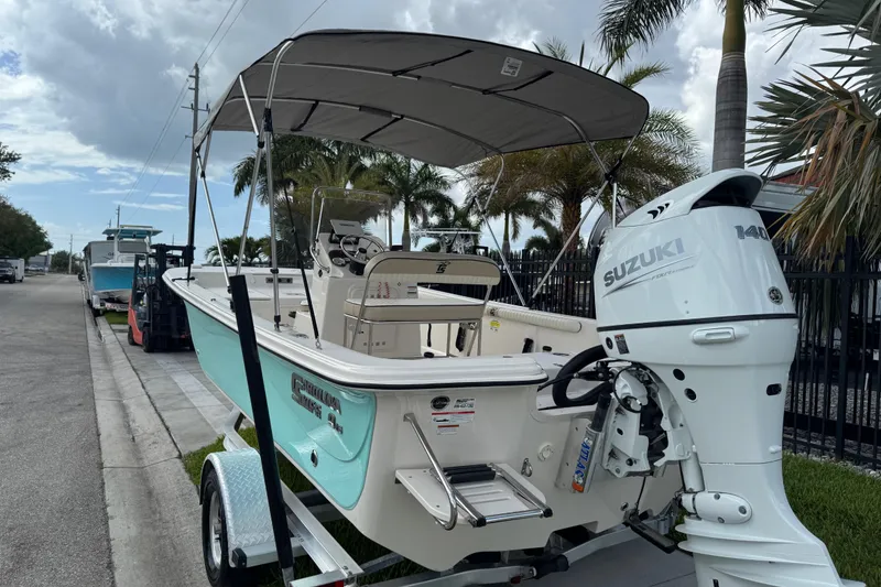 Slide: The Image of 2022 Carolina Skiff 19 LS boat with Suzuki 140 outboard motor on trailer. - 5