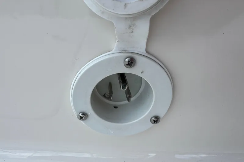 Slide: The Image of White circular fixture on a 2022 Carolina Skiff 19 LS boat. - 58