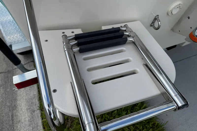 Slide: The Image of 2022 Carolina Skiff 19 LS boat ladder, stainless steel, folded on deck. - 6